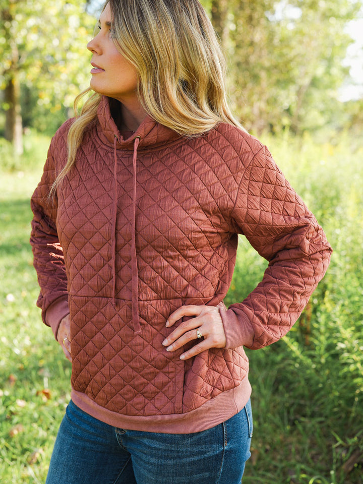 Quilted funnel neck pullover in rust