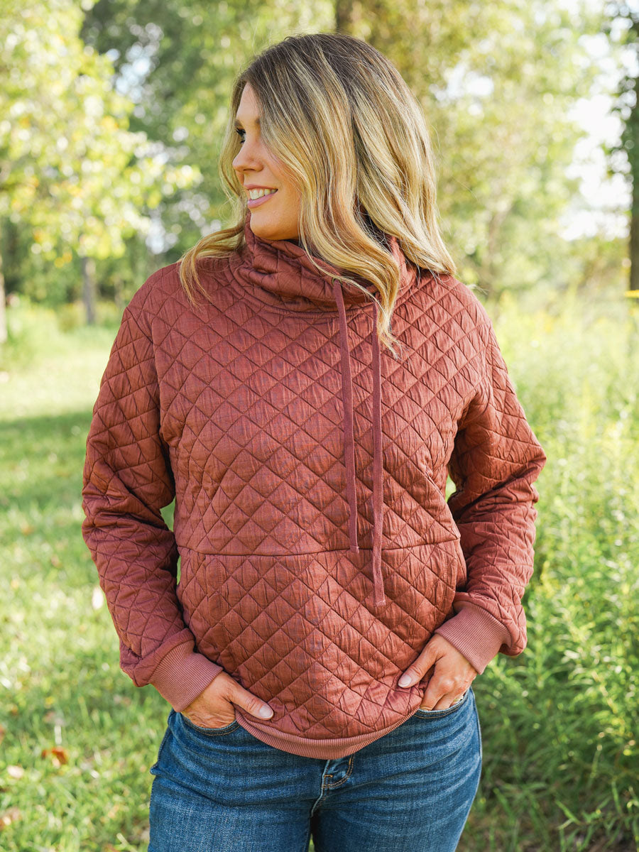 Quilted funnel neck pullover in rust